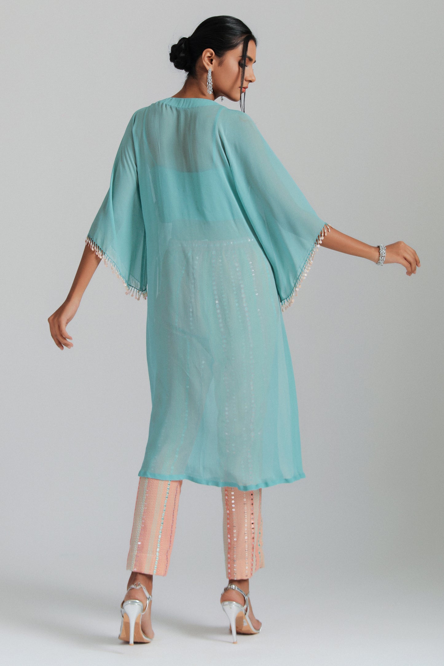 Georgette kaftan paired with mirror work trousers.