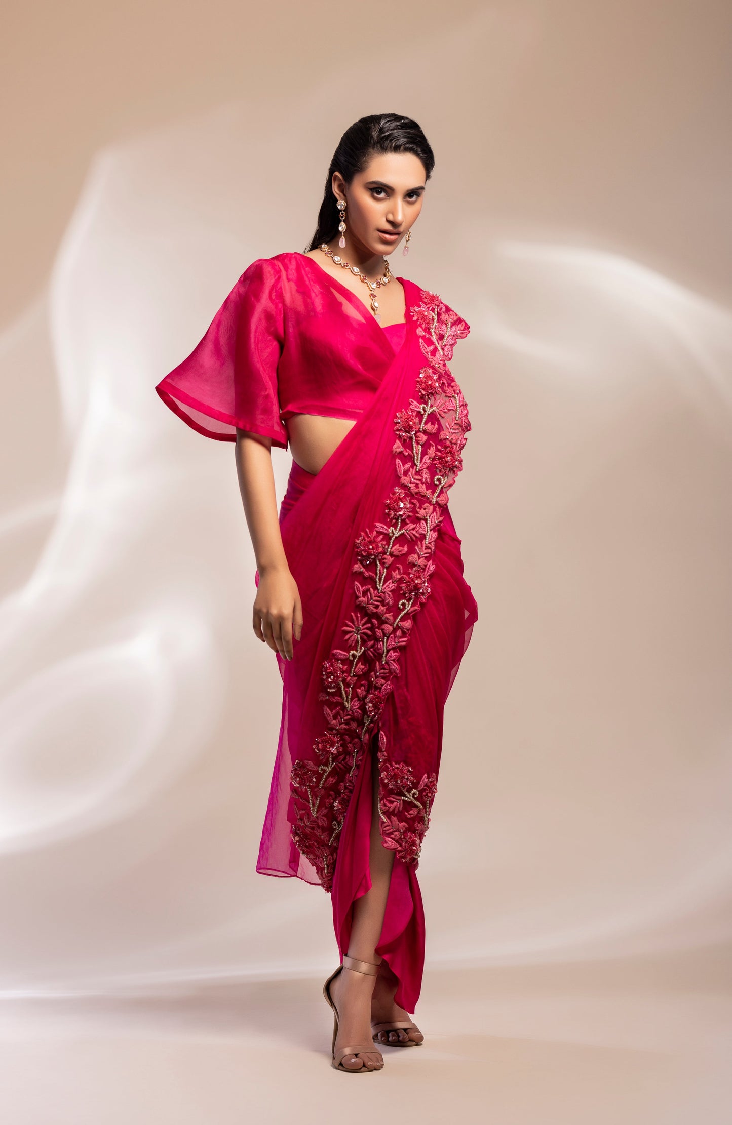 Bustier with a half jacket and a drape lungi skirt with attached pallu