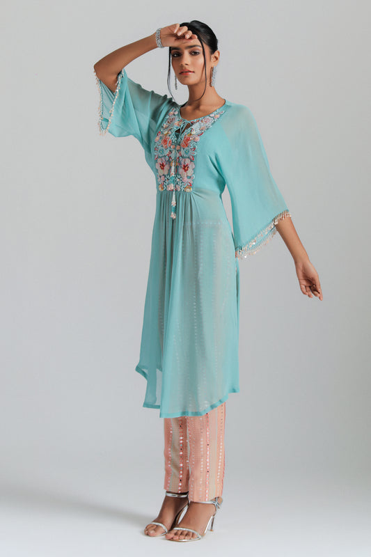 Georgette kaftan paired with mirror work trousers.